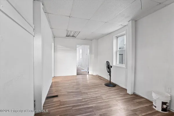 a view of a bathroom from a hallway