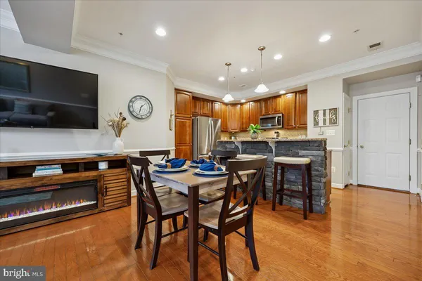 a kitchen with a table and chairs in it