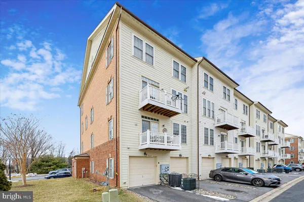 a view of a lake with houses in the back