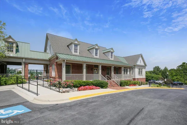 a view of a patio with a table and chairs and potted plants