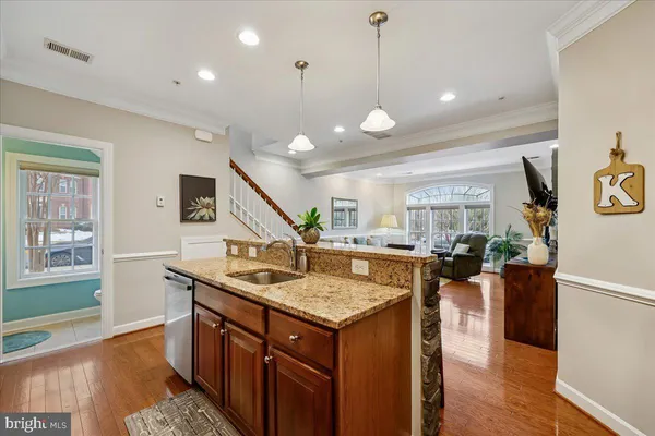 a kitchen with stainless steel appliances granite countertop a stove and a sink