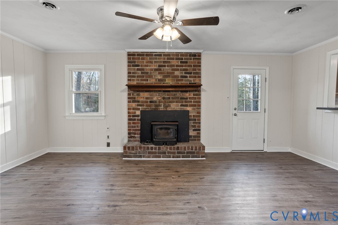 3843 Quinton Road Quinton, VA 23141 - Photo 14 of 26 wooden floor fireplace and windows in an empty room