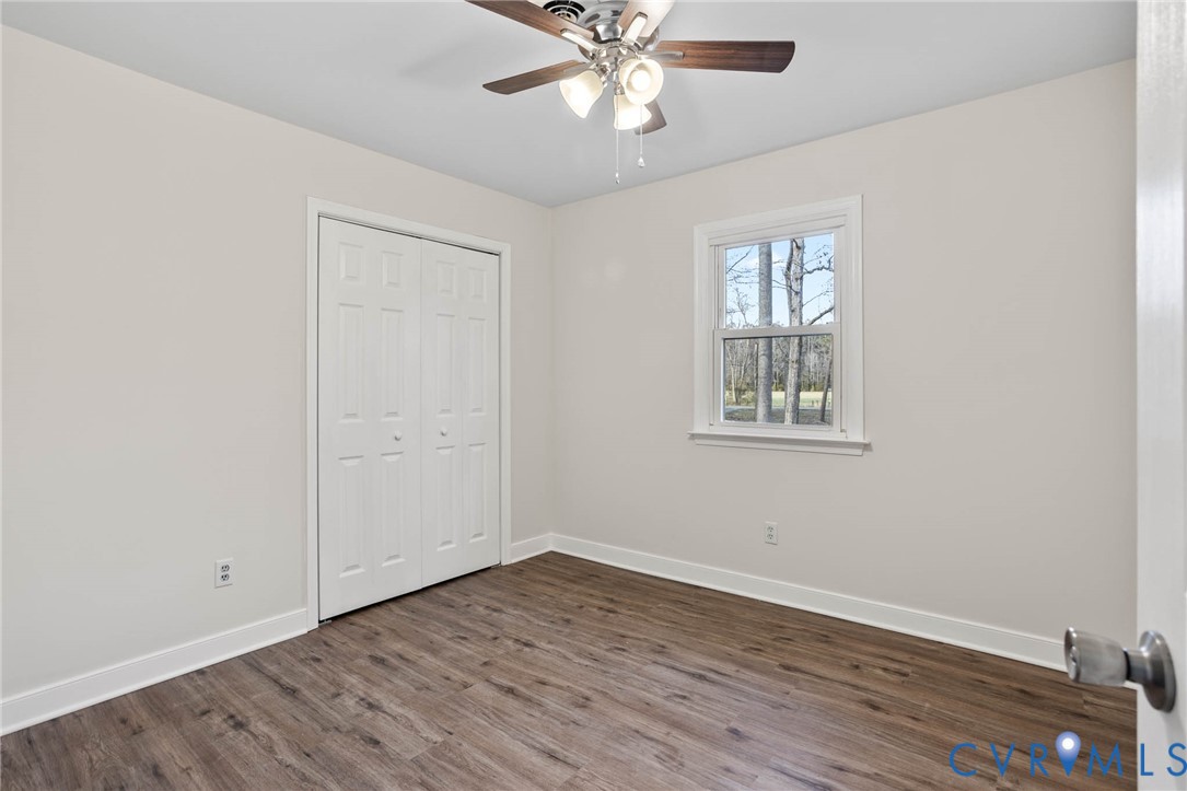 3843 Quinton Road Quinton, VA 23141 - Photo 22 of 26 wooden floor in an empty room with a window