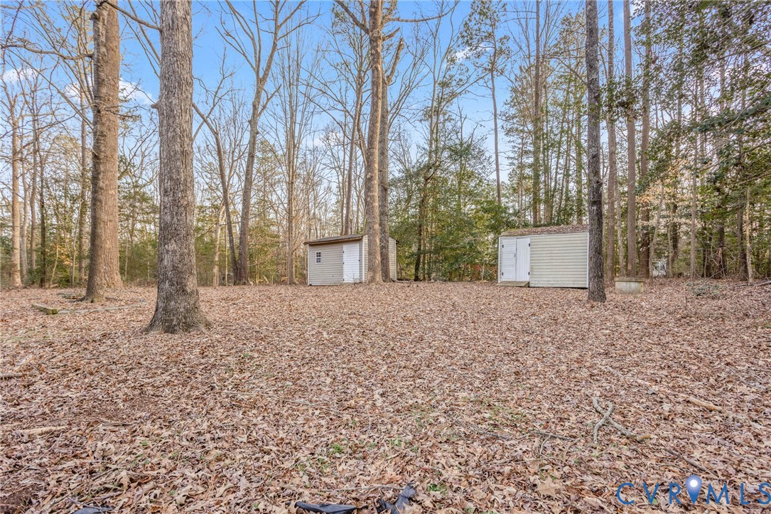 3843 Quinton Road Quinton, VA 23141 - Photo 25 of 26 a view of a backyard with large trees