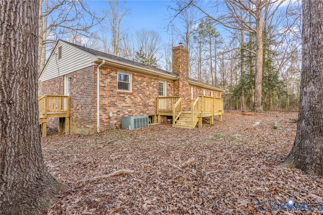 3843 Quinton Road Quinton, VA 23141 - Photo 26 of 26 a view of a house with a yard and sitting area