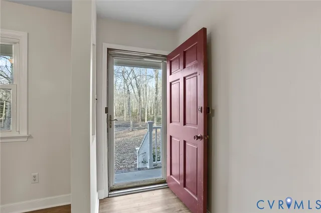 a view of front door with a mirror