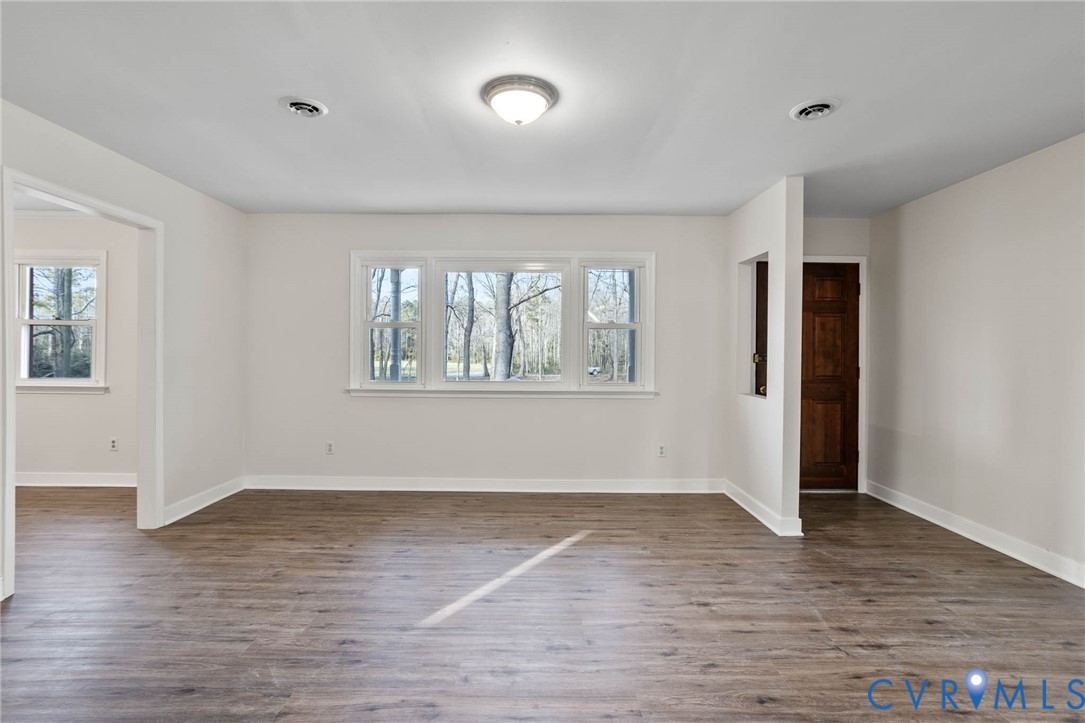 3843 Quinton Road Quinton, VA 23141 - Photo 7 of 26 wooden floor in an empty room with a window
