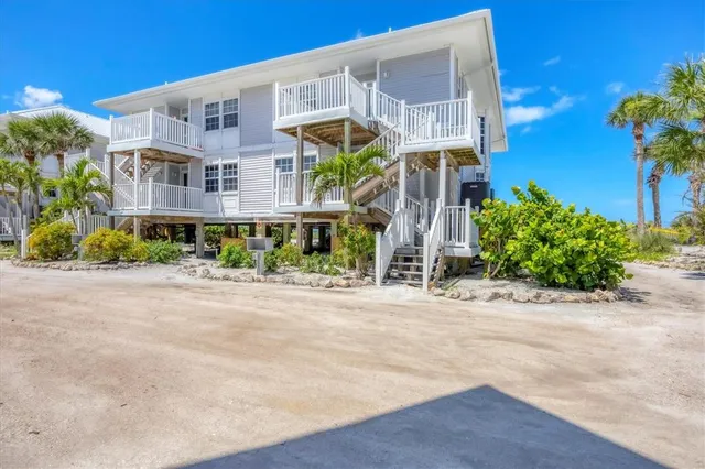 a view of a balcony with wooden floor