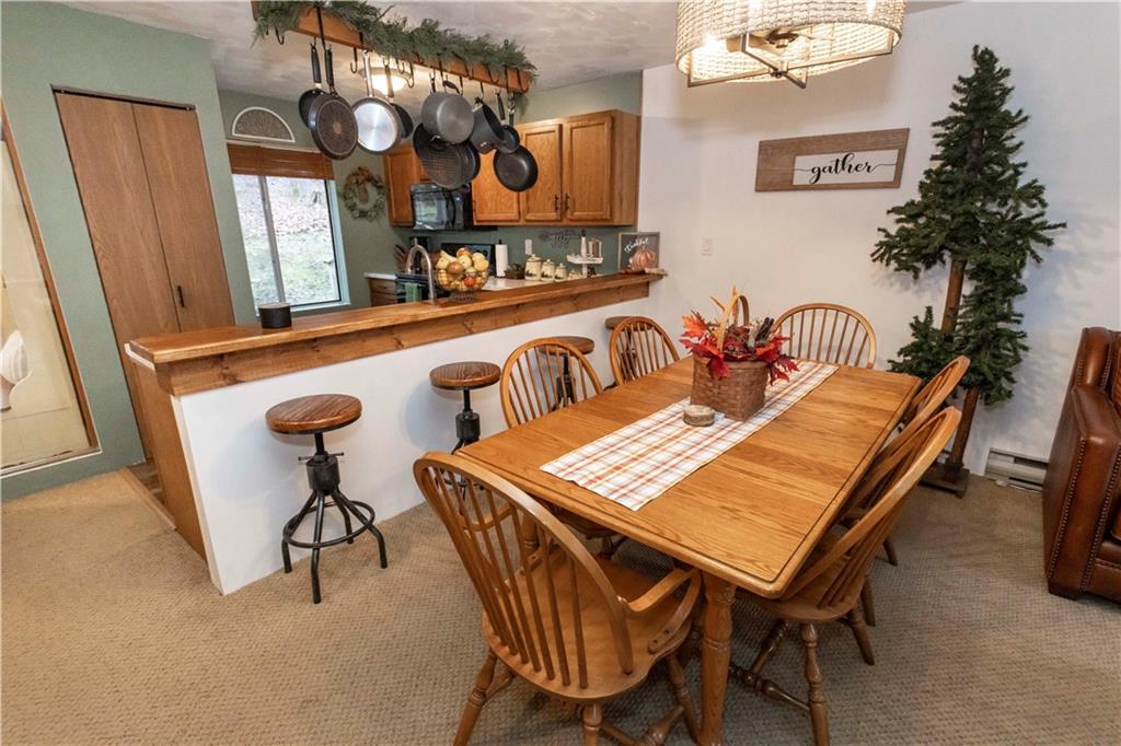 1817 Eagles Ridge Court Hidden Valley, PA 15502 - Photo 13 of 50 a view of a dining room with furniture and a chandelier