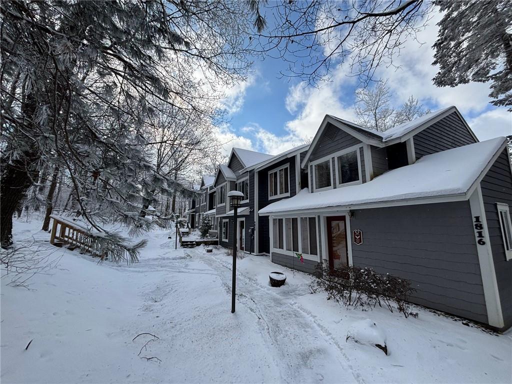 1817 Eagles Ridge Court Hidden Valley, PA 15502 - Photo 2 of 50 a view of a house with a snow in the yard