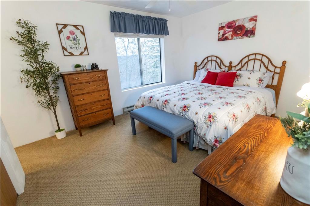 1817 Eagles Ridge Court Hidden Valley, PA 15502 - Photo 23 of 50 a bedroom with a bed and dresser with mirror