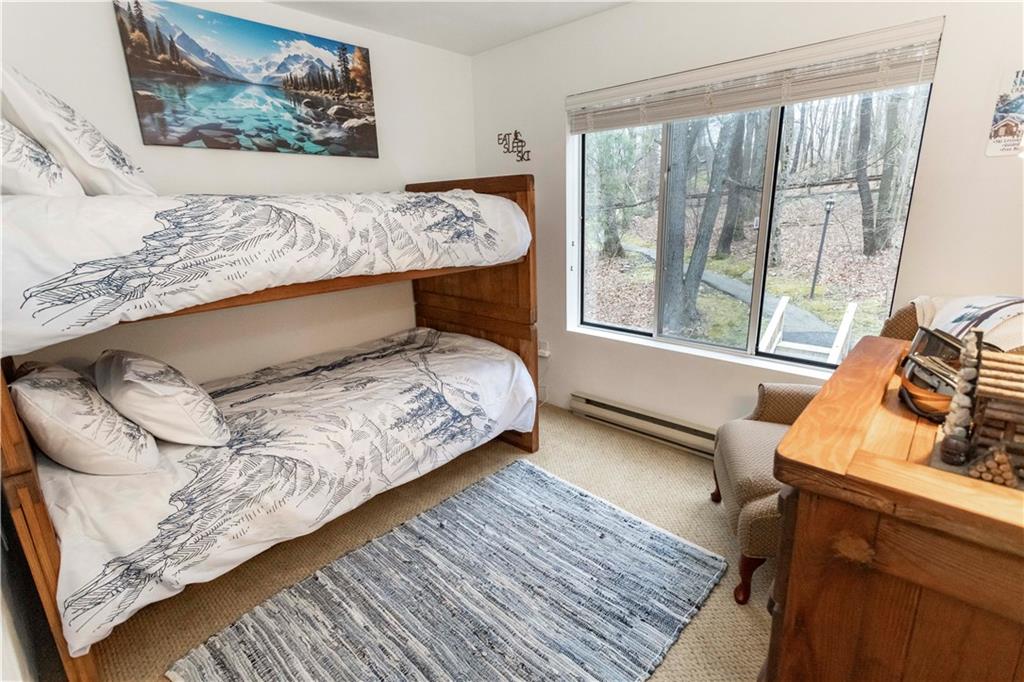 1817 Eagles Ridge Court Hidden Valley, PA 15502 - Photo 29 of 50 a bedroom with a bed and wooden floor