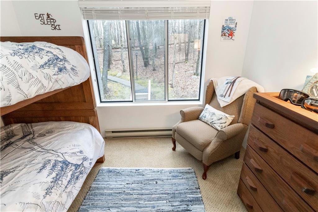 1817 Eagles Ridge Court Hidden Valley, PA 15502 - Photo 30 of 50 a bedroom with a bed and a couch