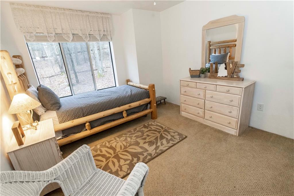 1817 Eagles Ridge Court Hidden Valley, PA 15502 - Photo 31 of 50 a bedroom with furniture and a window