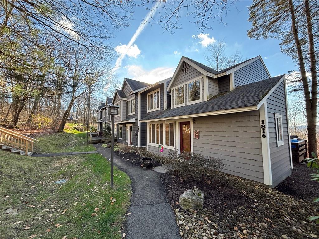 1817 Eagles Ridge Court Hidden Valley, PA 15502 - Photo 35 of 50 a front view of a house with garden