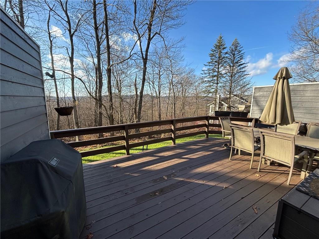 1817 Eagles Ridge Court Hidden Valley, PA 15502 - Photo 39 of 50 a view of a wooden deck with a bench