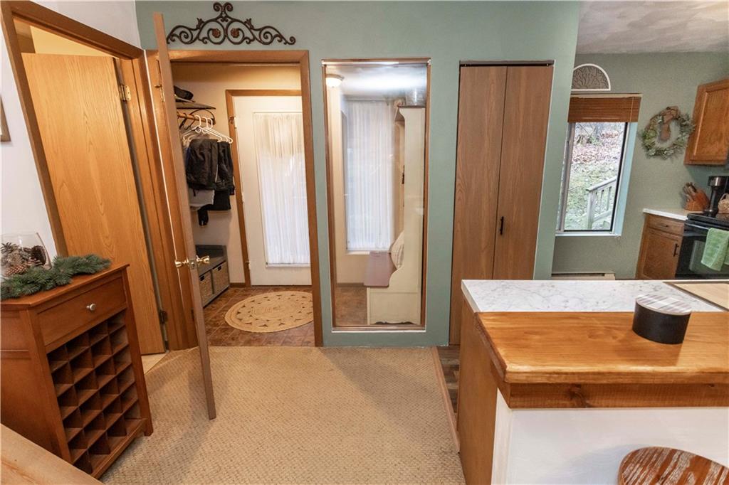1817 Eagles Ridge Court Hidden Valley, PA 15502 - Photo 7 of 50 a bathroom with a tub sink and mirror