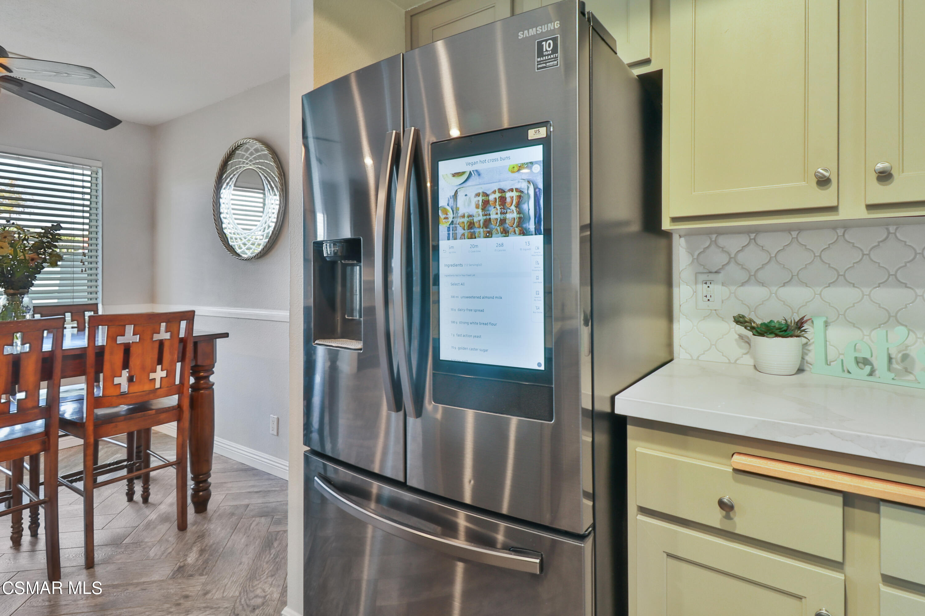 3974 Cochran Street, Unit 80 Simi Valley, CA 93063 - Photo 14 of 33 a kitchen with a refrigerator and cabinets