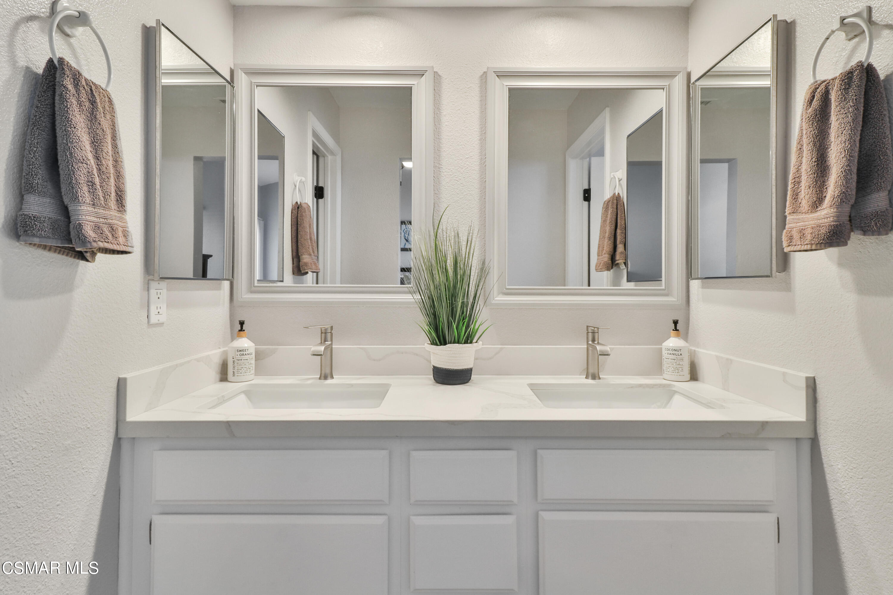 3974 Cochran Street, Unit 80 Simi Valley, CA 93063 - Photo 19 of 33 a bathroom with double sink and a mirror