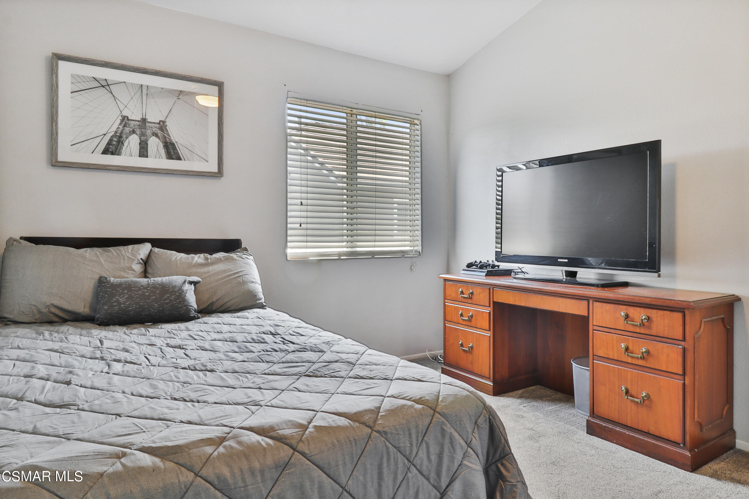 3974 Cochran Street, Unit 80 Simi Valley, CA 93063 - Photo 23 of 33 a bedroom with a bed and a flat screen tv