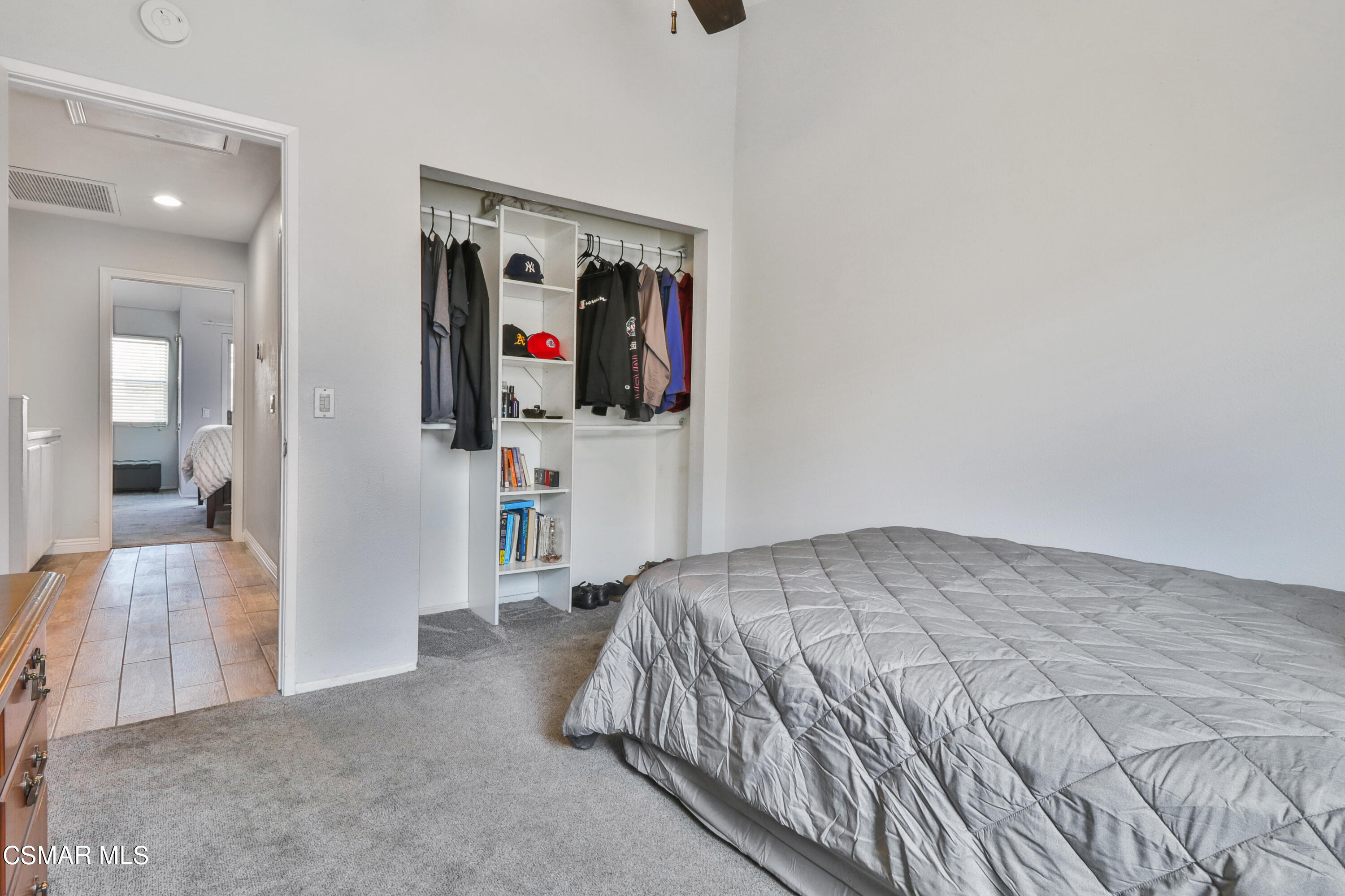 3974 Cochran Street, Unit 80 Simi Valley, CA 93063 - Photo 24 of 33 a bedroom with a bed and walk in closet