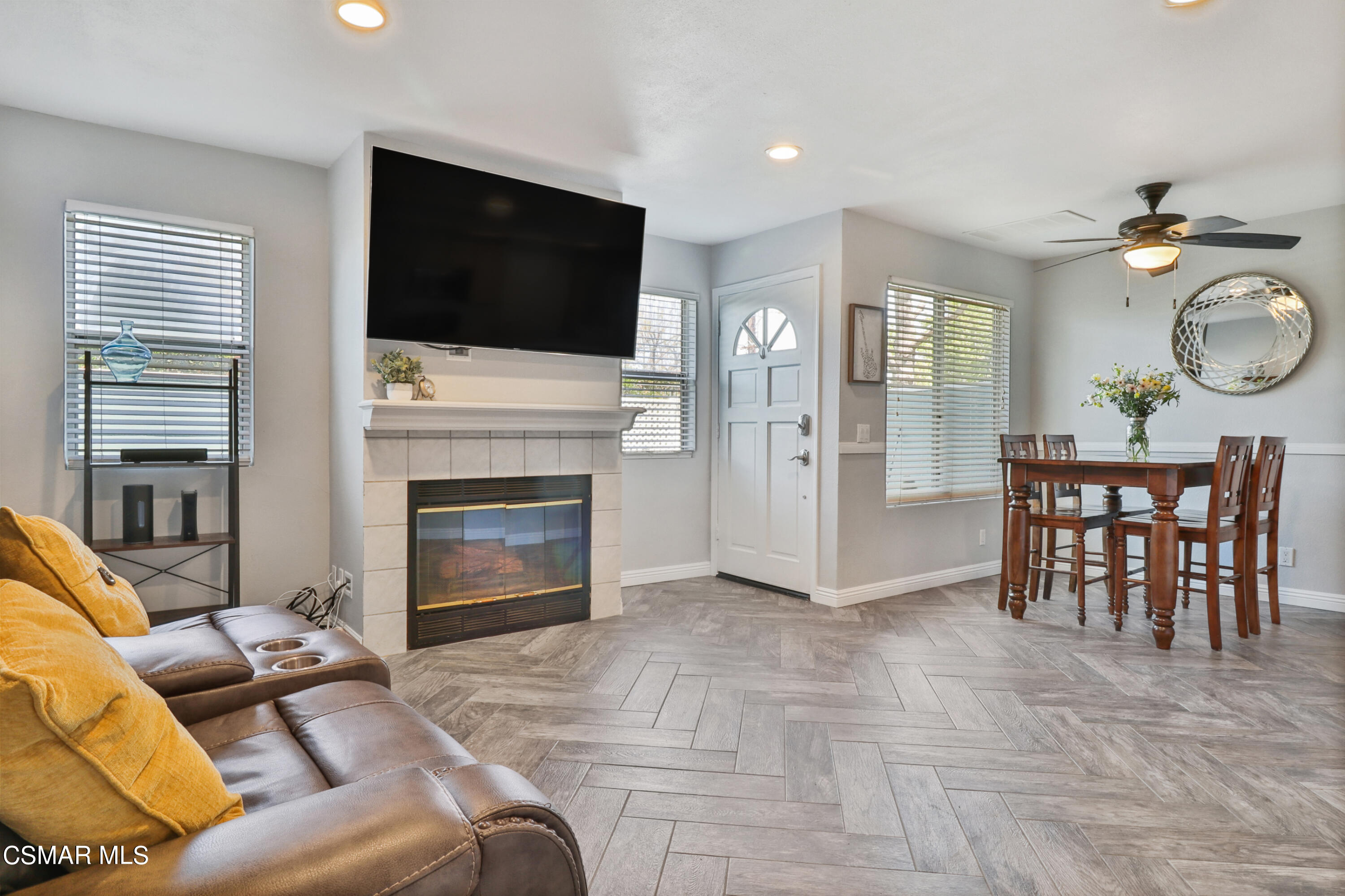 3974 Cochran Street, Unit 80 Simi Valley, CA 93063 - Photo 4 of 33 a living room with furniture a flat screen tv and a fireplace