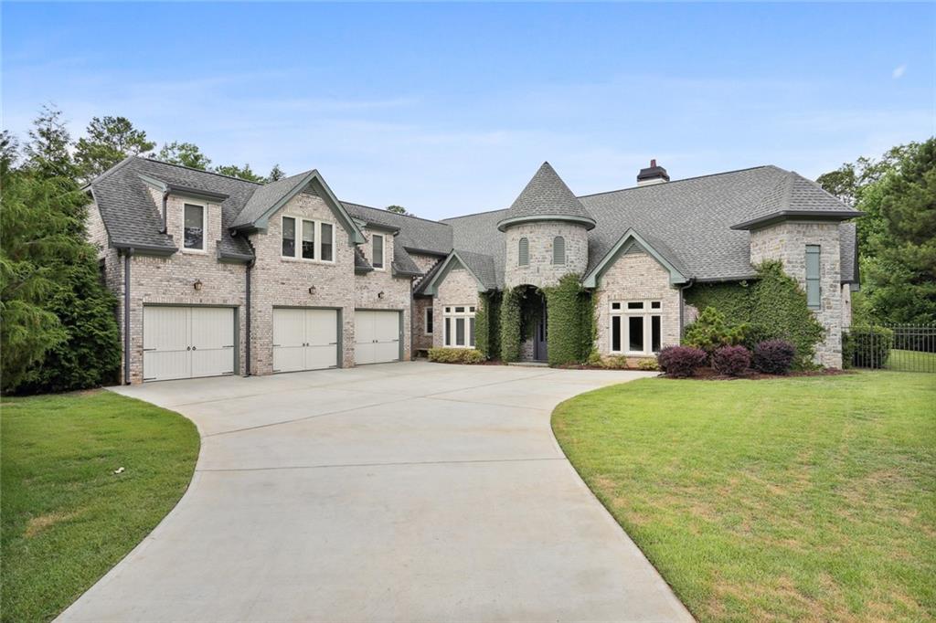 100 Roxbury Row Milton, GA 30004 - Photo 1 of 1 front view of a house with a yard