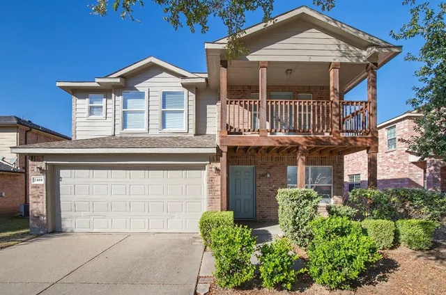 front view of a house with a garden
