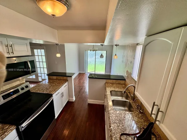a bathroom with a sink a mirror and a bathtub