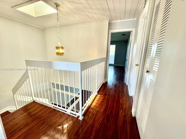 a view of entryway with wooden floor