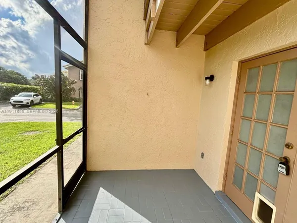 an entryway in a hallway with wooden floor