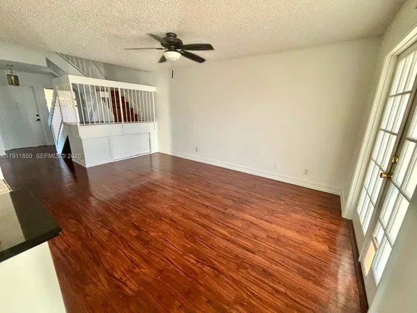 a view of an entryway with wooden floor