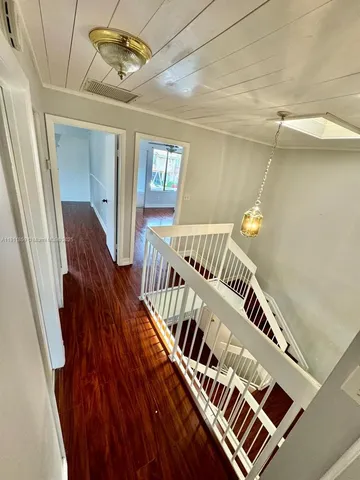 a view of an entryway with a workspace