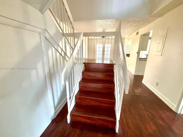 a view of entryway with wooden floor
