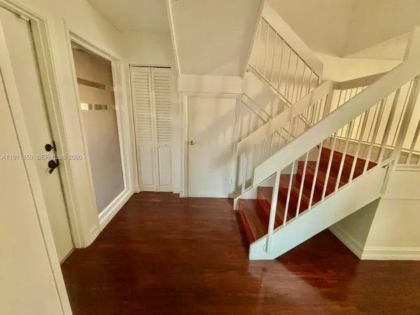 a view of entryway with wooden floor