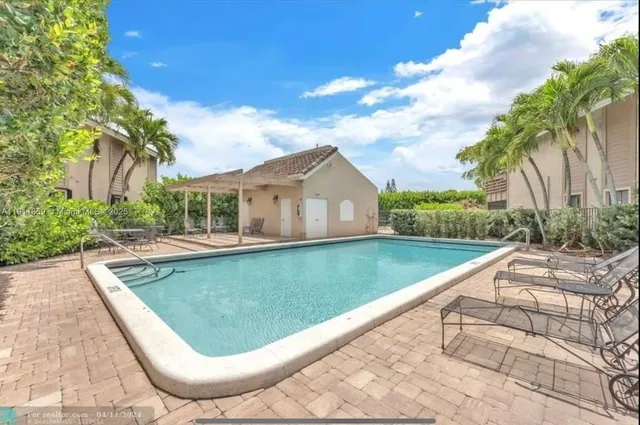 a view of swimming pool with a garden