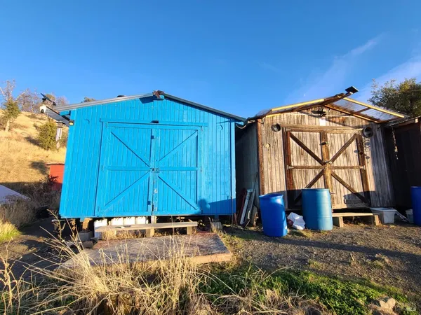a view of a backyard of a house