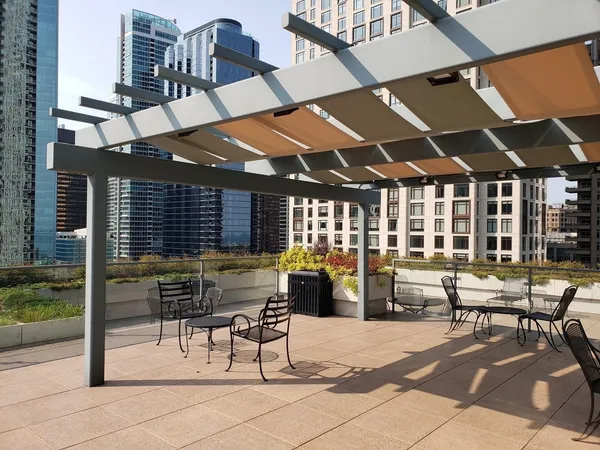 a view of a chairs and table in a patio