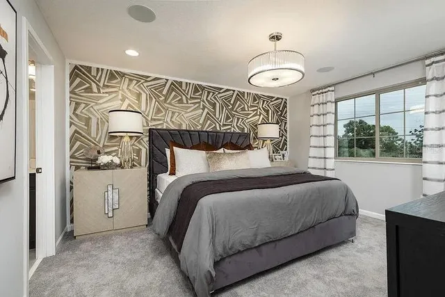 a bedroom with a bed and a mirror