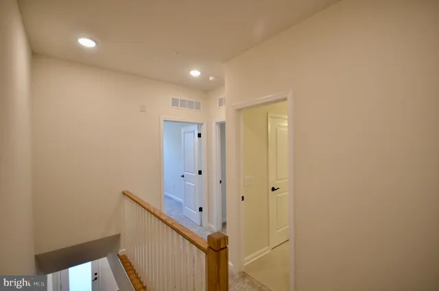 a view of an entryway with wooden floor
