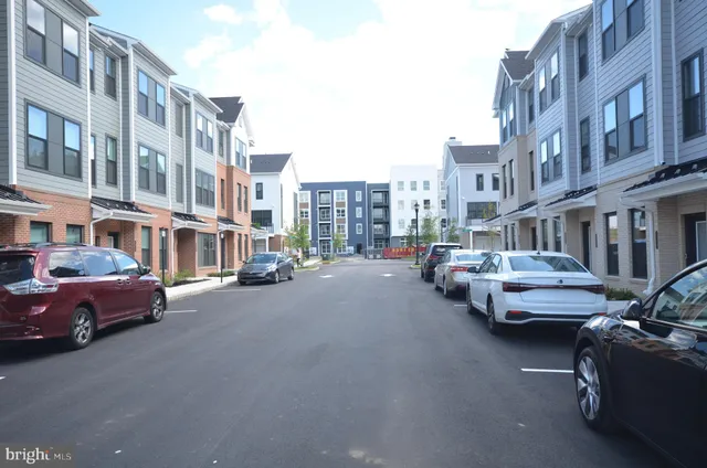 a city street lined with buildings and trees