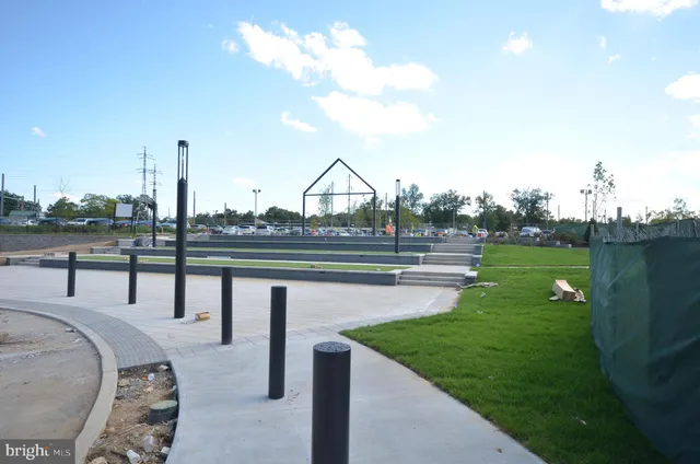 a swimming pool with outdoor seating and yard