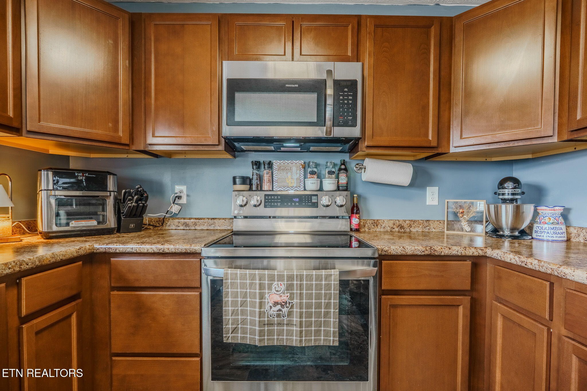 3215 Smith Road White Pine, TN 37890 - Photo 12 of 28 a kitchen with stainless steel appliances granite countertop a stove microwave and cabinets