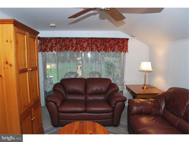 559 Tarrington Road Cherry Hill, NJ 08034 - Photo 13 of 25 a living room with a couch and a table