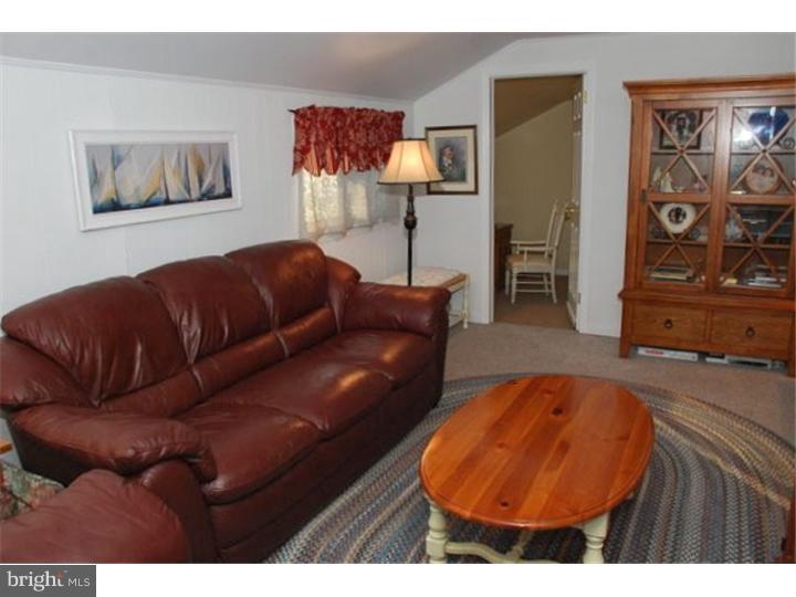 559 Tarrington Road Cherry Hill, NJ 08034 - Photo 14 of 25 a living room with furniture and wall paintings