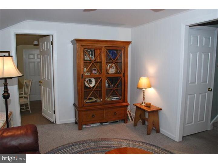559 Tarrington Road Cherry Hill, NJ 08034 - Photo 15 of 25 a view of a livingroom with furniture and a lamp with wooden floor