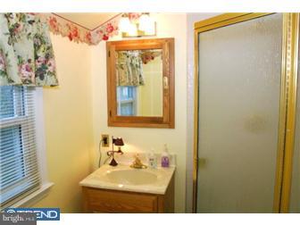 559 Tarrington Road Cherry Hill, NJ 08034 - Photo 19 of 25 a bathroom with a sink mirror and vanity