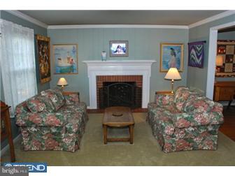 559 Tarrington Road Cherry Hill, NJ 08034 - Photo 5 of 25 a living room with furniture and a fireplace