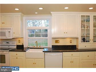 559 Tarrington Road Cherry Hill, NJ 08034 - Photo 8 of 25 a kitchen with a sink window and cabinets