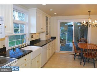 559 Tarrington Road Cherry Hill, NJ 08034 - Photo 9 of 25 a kitchen with granite countertop a sink and a stove